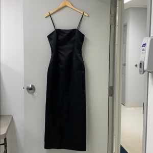 Black, full-length satin dress. Can be strapless